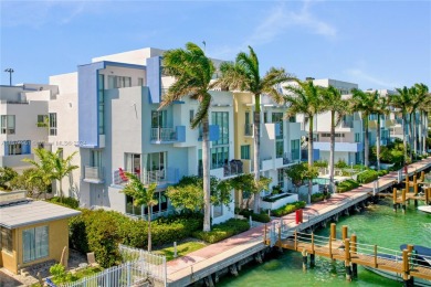 Indulge in waterfront luxury with this elegant 3Bed/3.5Bath on Normandy Shores Golf Course in Florida - for sale on GolfHomes.com, golf home, golf lot