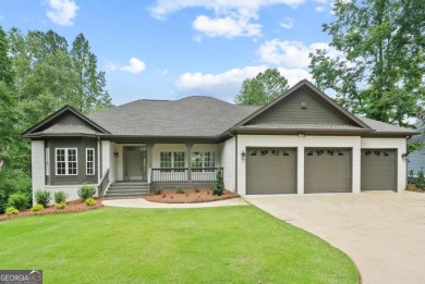 Experience refined lakefront living at its finest at 1390 Winged on Harbor Club Golf and Country Club in Georgia - for sale on GolfHomes.com, golf home, golf lot