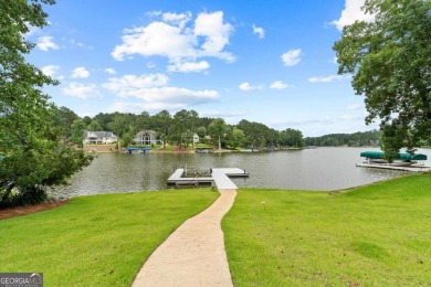 Experience refined lakefront living at its finest at 1390 Winged on Harbor Club Golf and Country Club in Georgia - for sale on GolfHomes.com, golf home, golf lot