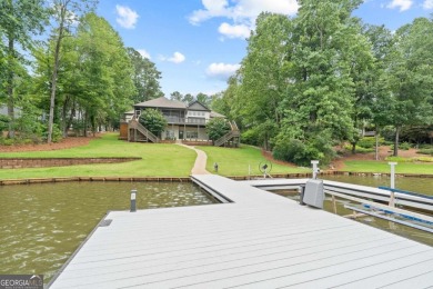 Experience refined lakefront living at its finest at 1390 Winged on Harbor Club Golf and Country Club in Georgia - for sale on GolfHomes.com, golf home, golf lot