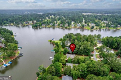Experience refined lakefront living at its finest at 1390 Winged on Harbor Club Golf and Country Club in Georgia - for sale on GolfHomes.com, golf home, golf lot
