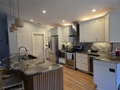 Check this Completely renovated single story home. Move-in-ready on Stoneybrook West in Florida - for sale on GolfHomes.com, golf home, golf lot