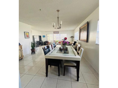 Magnificent corner unit on the convenient first floor. Swimming on Flamingo Lakes Country Club in Florida - for sale on GolfHomes.com, golf home, golf lot