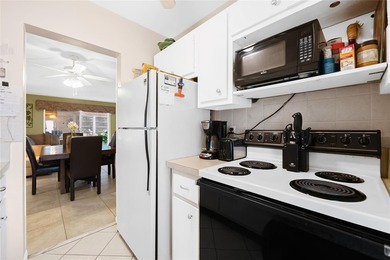 Spacious 2-bedroom, 1-bathroom condo located in a private golf on Leisureville Community Association in Florida - for sale on GolfHomes.com, golf home, golf lot