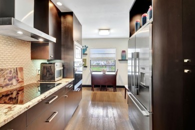 Beautifully updated second-floor, two-bedroom, two-bath on Hunters Run Golf and Country Club in Florida - for sale on GolfHomes.com, golf home, golf lot