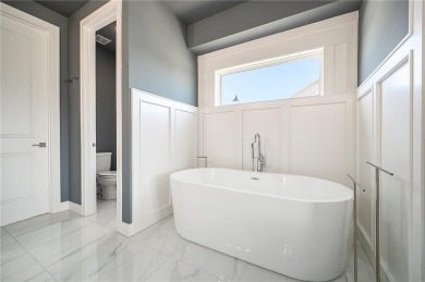 Step into luxury with the sought-after Madison II Reverse by Don on Staley Farms Golf Club in Missouri - for sale on GolfHomes.com, golf home, golf lot