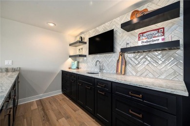 Step into luxury with the sought-after Madison II Reverse by Don on Staley Farms Golf Club in Missouri - for sale on GolfHomes.com, golf home, golf lot