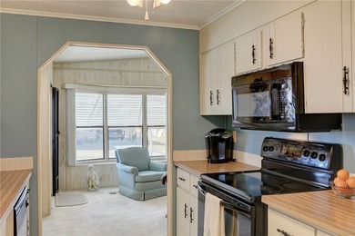 Furnished beauty just steps from the golf course! This on Barefoot Bay Golf Course in Florida - for sale on GolfHomes.com, golf home, golf lot