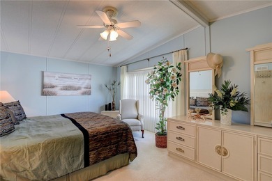 Furnished beauty just steps from the golf course! This on Barefoot Bay Golf Course in Florida - for sale on GolfHomes.com, golf home, golf lot