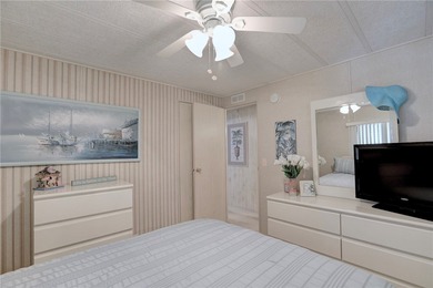 Furnished beauty just steps from the golf course! This on Barefoot Bay Golf Course in Florida - for sale on GolfHomes.com, golf home, golf lot