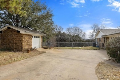 Nestled in the prestigious Pecan Plantation Country Club (PPCC) on Pecan Plantation Country Club in Texas - for sale on GolfHomes.com, golf home, golf lot