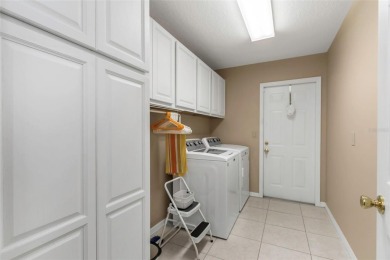 Discover timeless elegance and peaceful living in this stunning on The Links Golf Course in Florida - for sale on GolfHomes.com, golf home, golf lot