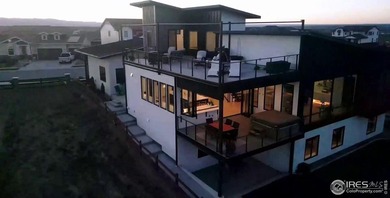 Welcome to elevated Colorado living at its finest. Perched above on Raindance National Golf Course in Colorado - for sale on GolfHomes.com, golf home, golf lot