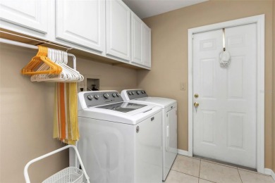 Discover timeless elegance and peaceful living in this stunning on The Links Golf Course in Florida - for sale on GolfHomes.com, golf home, golf lot