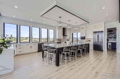 Welcome to elevated Colorado living at its finest. Perched above on Raindance National Golf Course in Colorado - for sale on GolfHomes.com, golf home, golf lot