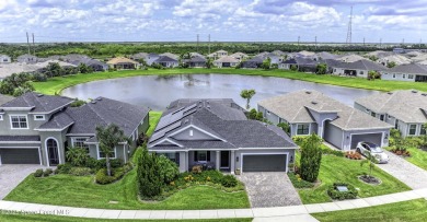 Enjoy lake views and vibrant sunsets from your gas-heated pool on Duran Golf Course in Florida - for sale on GolfHomes.com, golf home, golf lot