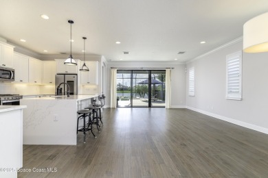 Enjoy lake views and vibrant sunsets from your gas-heated pool on Duran Golf Course in Florida - for sale on GolfHomes.com, golf home, golf lot