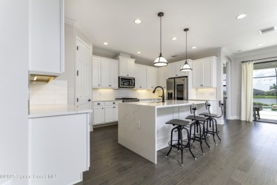 Enjoy lake views and vibrant sunsets from your gas-heated pool on Duran Golf Course in Florida - for sale on GolfHomes.com, golf home, golf lot