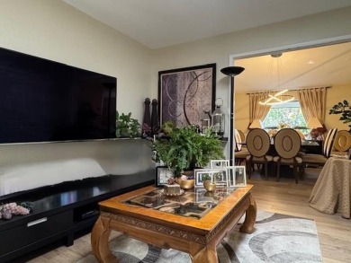Located on a scenic cul-de-sac, this beautifully renovated home on Villages Golf and Country Club in California - for sale on GolfHomes.com, golf home, golf lot