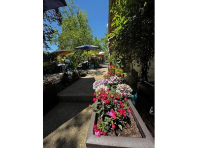 Located on a scenic cul-de-sac, this beautifully renovated home on Villages Golf and Country Club in California - for sale on GolfHomes.com, golf home, golf lot