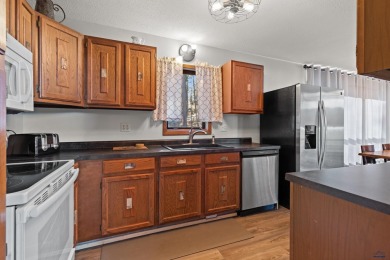 TURNKEY CABIN RETREAT. This three-level cabin sits in the pines on  in South Dakota - for sale on GolfHomes.com, golf home, golf lot