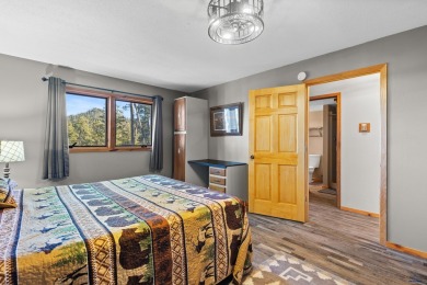 TURNKEY CABIN RETREAT. This three-level cabin sits in the pines on  in South Dakota - for sale on GolfHomes.com, golf home, golf lot