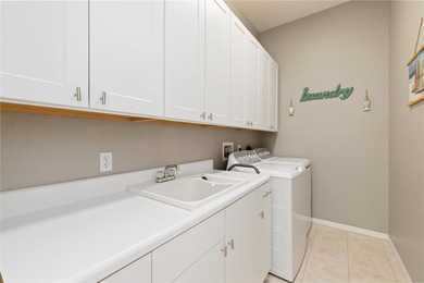 Welcome to this move-in ready saltwater pool home in Rotonda on Pinemoor West Golf Club in Florida - for sale on GolfHomes.com, golf home, golf lot