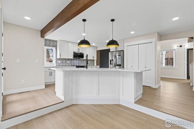 Architectural elegance meets modern luxury in this exceptional on Cattail Creek Golf Course in Colorado - for sale on GolfHomes.com, golf home, golf lot