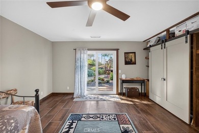 Set on 1.33 acres along a private road in a small community on Pala Mesa Resort in California - for sale on GolfHomes.com, golf home, golf lot