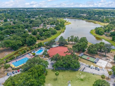 Water Front furnished 55+ Condo.  Enjoy lakefront living on Lake on Country Club At Silver Springs Shores in Florida - for sale on GolfHomes.com, golf home, golf lot