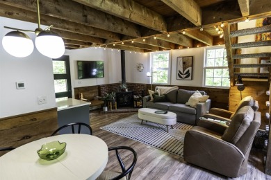 This beautifully reimagined Quechee Hollow end unit is turnkey! on Quechee Club in Vermont - for sale on GolfHomes.com, golf home, golf lot