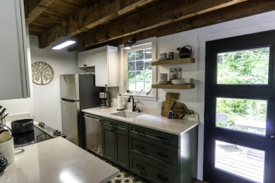 This beautifully reimagined Quechee Hollow end unit is turnkey! on Quechee Club in Vermont - for sale on GolfHomes.com, golf home, golf lot