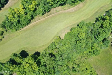 Are you looking to build your dream home with views of Grand on Lochen Heath Golf Course in Michigan - for sale on GolfHomes.com, golf home, golf lot