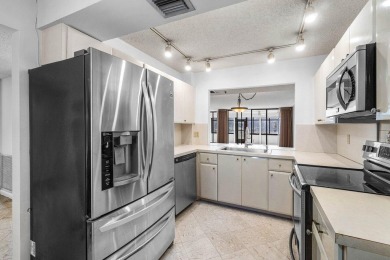 Welcome to this beautifully maintained first-floor corner condo on The Country Club At Boca Raton in Florida - for sale on GolfHomes.com, golf home, golf lot