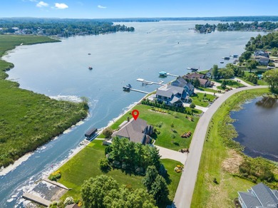 Experience refined waterfront living on Lake Wawasee in this on Wawasee Golf Club in Indiana - for sale on GolfHomes.com, golf home, golf lot
