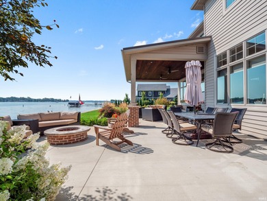 Experience refined waterfront living on Lake Wawasee in this on Wawasee Golf Club in Indiana - for sale on GolfHomes.com, golf home, golf lot