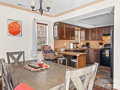 Positioned above Maggie Valley Club & Resort, this 2 bedroom, 2 on Maggie Valley Resort and Country Club in North Carolina - for sale on GolfHomes.com, golf home, golf lot