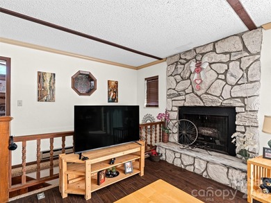 Positioned above Maggie Valley Club & Resort, this 2 bedroom, 2 on Maggie Valley Resort and Country Club in North Carolina - for sale on GolfHomes.com, golf home, golf lot