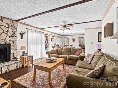 Positioned above Maggie Valley Club & Resort, this 2 bedroom, 2 on Maggie Valley Resort and Country Club in North Carolina - for sale on GolfHomes.com, golf home, golf lot