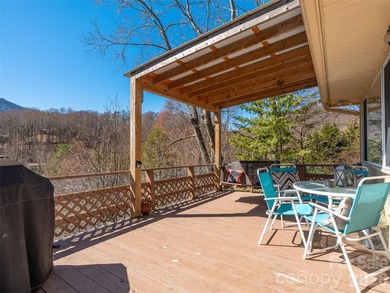 Positioned above Maggie Valley Club & Resort, this 2 bedroom, 2 on Maggie Valley Resort and Country Club in North Carolina - for sale on GolfHomes.com, golf home, golf lot