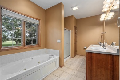Enjoy scenic views of Mill Run Golf Course from this bright and on Mill Run Golf Course in Wisconsin - for sale on GolfHomes.com, golf home, golf lot