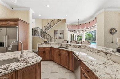 Discover refined living in this custom-built, two-story estate on Naples National Golf Club in Florida - for sale on GolfHomes.com, golf home, golf lot