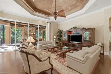 Discover refined living in this custom-built, two-story estate on Naples National Golf Club in Florida - for sale on GolfHomes.com, golf home, golf lot