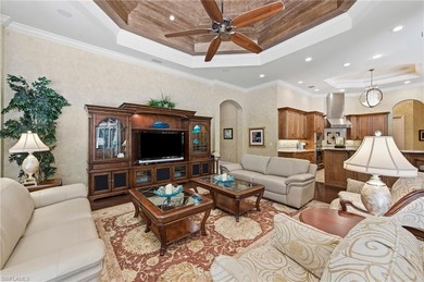 Discover refined living in this custom-built, two-story estate on Naples National Golf Club in Florida - for sale on GolfHomes.com, golf home, golf lot
