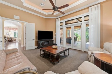 Discover refined living in this custom-built, two-story estate on Naples National Golf Club in Florida - for sale on GolfHomes.com, golf home, golf lot