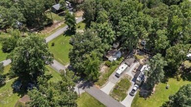 LOCATION!! LOCATION!! Lots of Potential for This Level Camp Lot on River Golf and County Club at Lake Royale in North Carolina - for sale on GolfHomes.com, golf home, golf lot