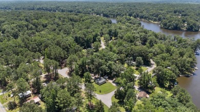 LOCATION!! LOCATION!! Lots of Potential for This Level Camp Lot on River Golf and County Club at Lake Royale in North Carolina - for sale on GolfHomes.com, golf home, golf lot