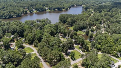LOCATION!! LOCATION!! Lots of Potential for This Level Camp Lot on River Golf and County Club at Lake Royale in North Carolina - for sale on GolfHomes.com, golf home, golf lot