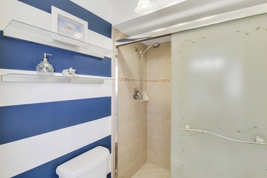 Embrace resort-style living in this inviting 2BR/2BA patio home on PGA National Golf Club in Florida - for sale on GolfHomes.com, golf home, golf lot