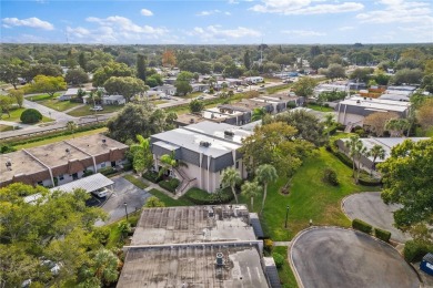 This top-floor condo sits high and dry in a non-flood zone on Bayou Golf Club in Florida - for sale on GolfHomes.com, golf home, golf lot